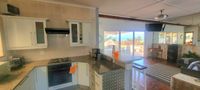 spacious kitchen near sundeck and entertainment area